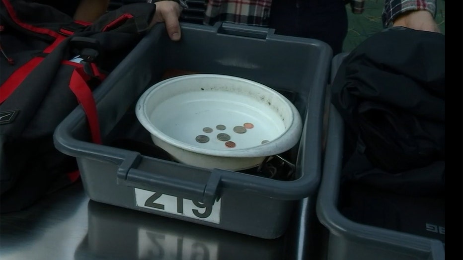 Coins inside a TSA bin