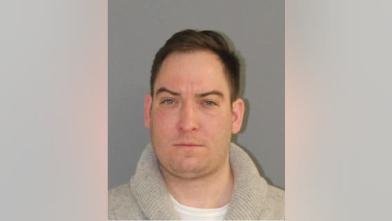 Man charged with threatening suspect in student killing