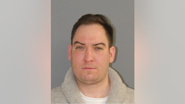 Man charged with threatening suspect in student killing