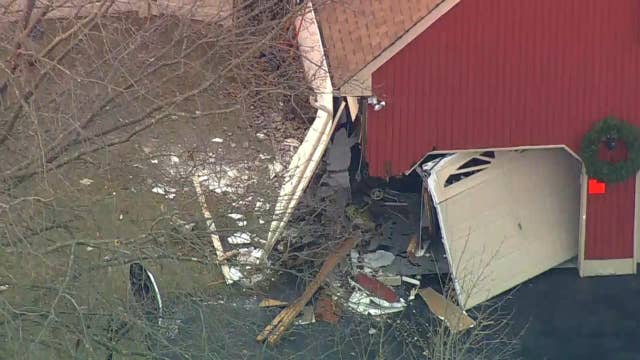 Vehicle crashes into NJ house