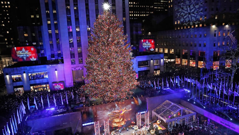 Rockefeller Center Christmas tree is illuminated by multi-colored LEDs