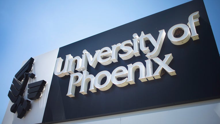 SCHAUMBURG, IL - JULY 30: A sign marks the location of the University of Phoenix Chicago Campus on July 30, 2015 in Schaumburg, Illinois. The university, the nation's largest recipient of veteran educational funds, is under federal investigation for possible deceptive or unfair business practices. (Photo by Scott Olson/Getty Images)