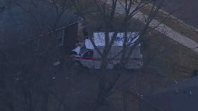 Ambulance crashes into NJ house