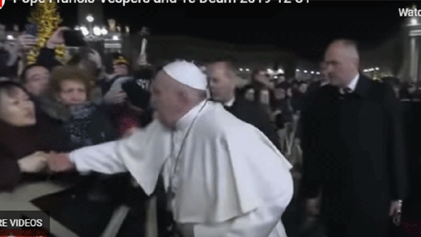 Pope apologizes for slapping hand of woman who pulled him