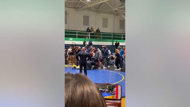 Father charged with assault after tackling son's opponent