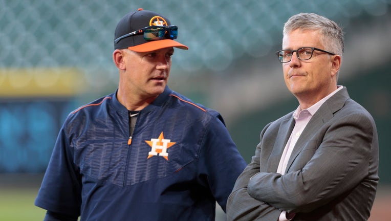 HOUSTON, TX - APRIL 04: Manager A.J. Hinch #14 of the Houston Astros and general manager Jeff Luhnow talk during batting practice at Minute Maid Park on April 4, 2017 in Houston, Texas.