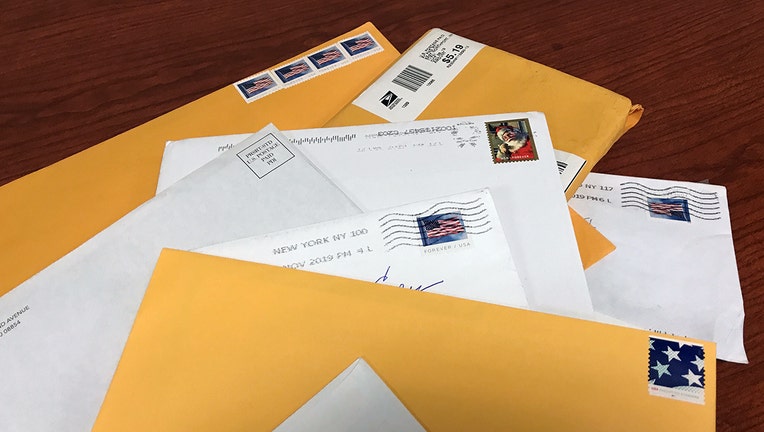 Unopened mail envelopes