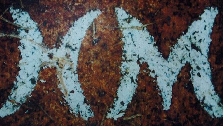 Investigators released this photo a belt with the initials HM or WH in connection with the Gilgo Beach murders.