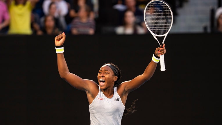 Coco Gauff celebrates after winning her third round match against Naomi Osaka on day five of the 2020 Australian Open at Melbourne Park on January 24, 2020 in Melbourne, Australia. (Photo by TPN/Getty Images)