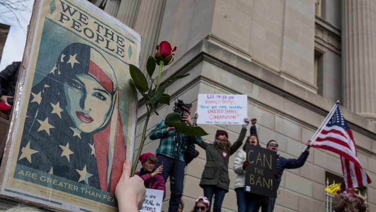 Demonstrators gather near The White House to protest President Donald Trump's travel ban on seven Muslim countries on January 29, 2017 in Washington, DC.