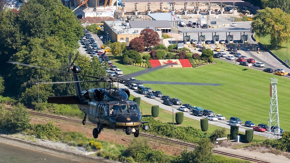 CBP helicopter flies near the border