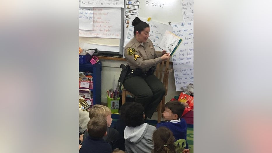 Detective-Amber-Leist-reading-to-kids.jpg