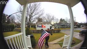 FedEx driver stops to pick up, fold fallen American flag