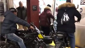 NYPD investigates men on motorbikes on subway train