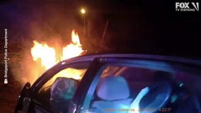 Cops pull woman from burning car in Connecticut