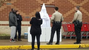 Deputies confront black man wearing KKK robe