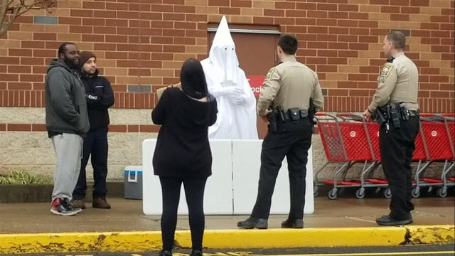 Deputies confront black man wearing KKK robe
