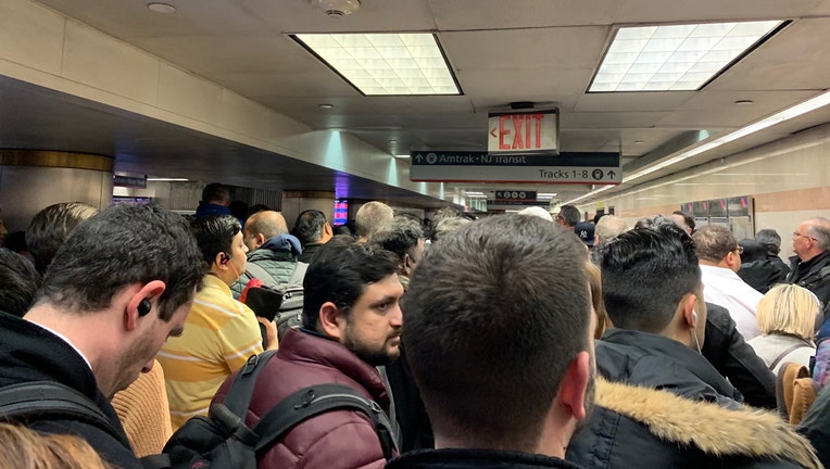 Crowds wait in Penn Station to board New Jersey Transit trains, Feb. 3, 2020.