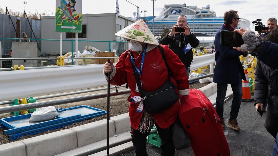Passengers Disembark Cruise Ship After Quarantine Ends In Japan
