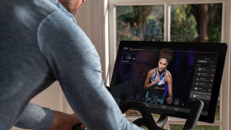A touchscreen of a Peloton exercise bike