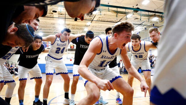 NCAA hoops game in Baltimore held in empty gym for COVID-19