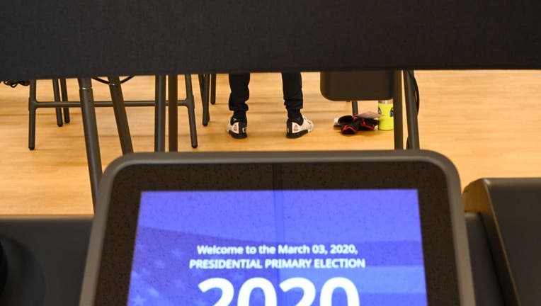 California voters cast their ballot on March 2, 2020 ahead of Super Tuesday during early voting for the California presidential primary election the YMCA in Burbank, California.
