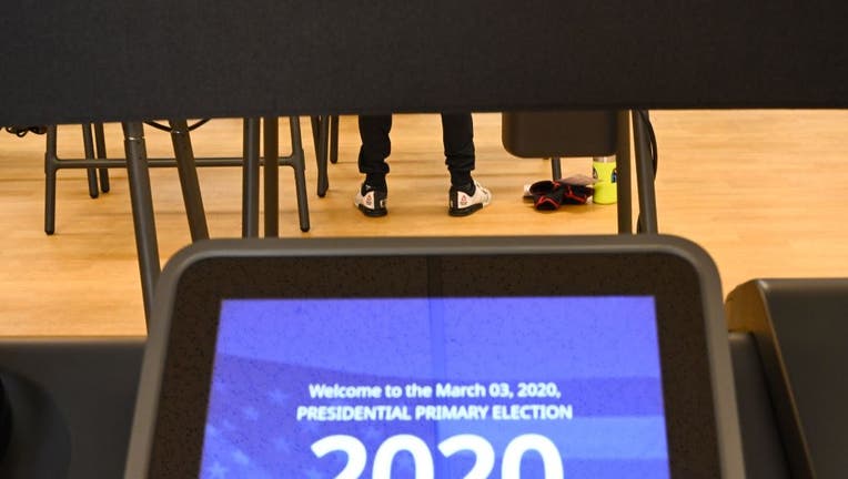 California voters cast their ballot on March 2, 2020 ahead of Super Tuesday during early voting for the California presidential primary election the YMCA in Burbank, California. 