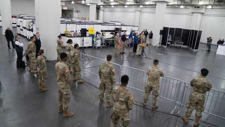 Cuomo, state and FEMA officials, and soldiers inside the Javits Center