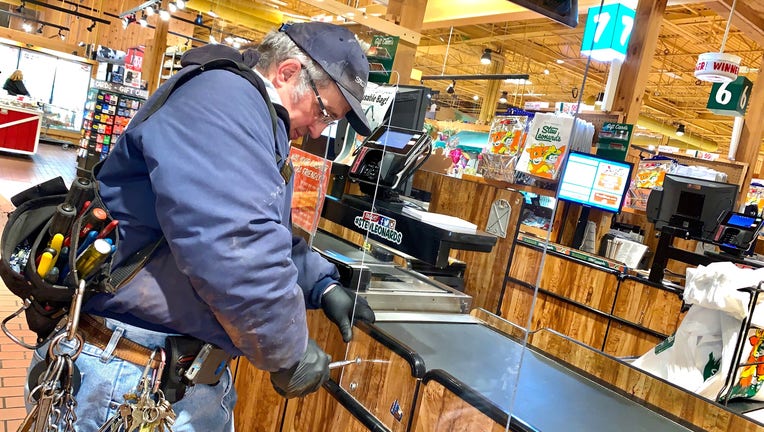 A man installs a barrier