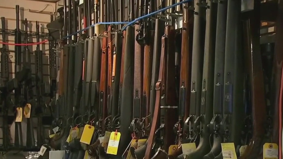 A rack of rifles for sale at a gun shop