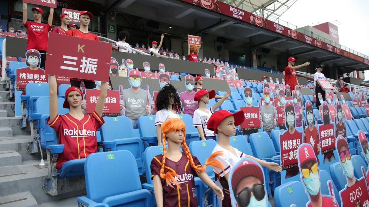 Taiwan opens baseball season with mannequin fans, robot cheerleaders