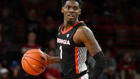 College basketball player charged with murder