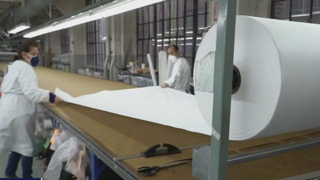 NYC luxury clothing maker shifts to PPE