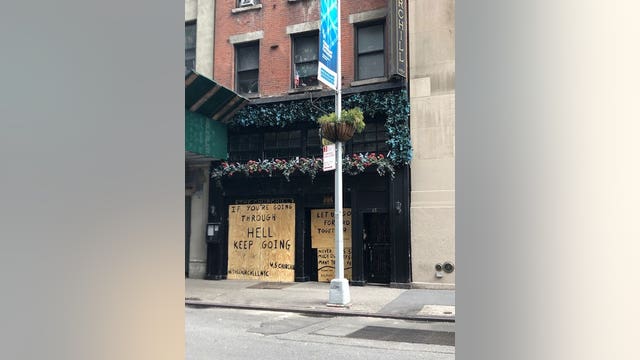 Store owners boarding up buildings across Manhattan