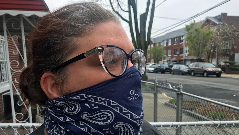 Woman wearing a blue and white bandana