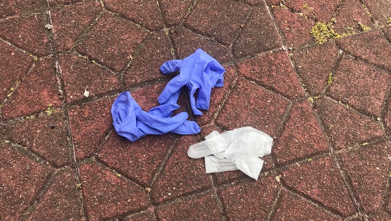 Nitrile gloves on the ground