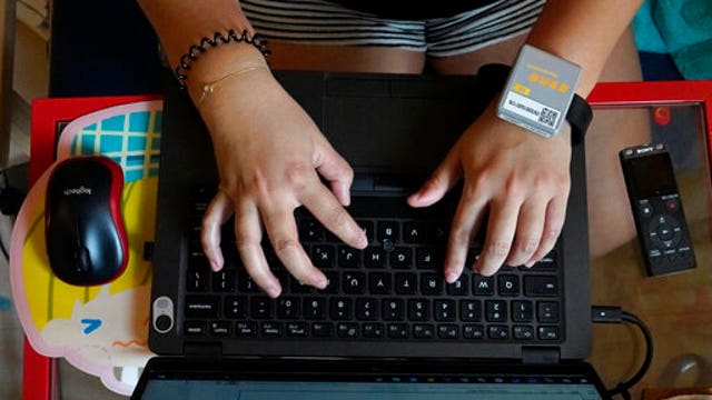 Quarantine and a monitoring bracelet for Hong Kong returnees