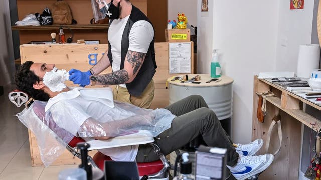 Pizzas (and haircuts) back on the menu, but with warnings