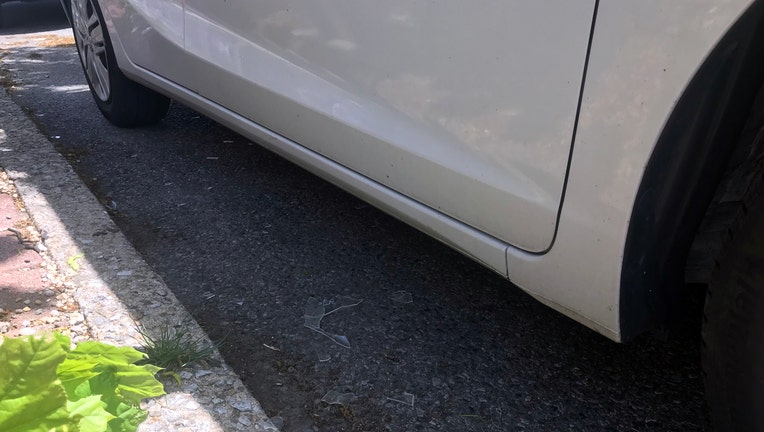 Close up of a fender of a car and broken debris