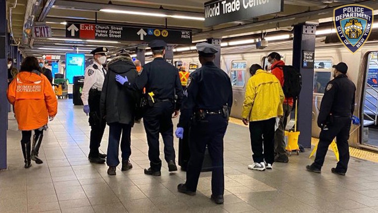 Police officers on a subway platform