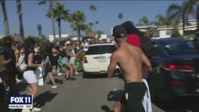 Car careens through crowd of peaceful protesters in Newport Beach; driver in custody