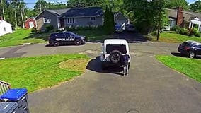 Video shows 10-year-old boy stopping driveway basketball game to hide from passing police car