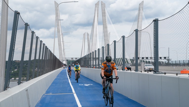 Cyclists ride along a multiuse path on the Mario M. Cuomo Bridge