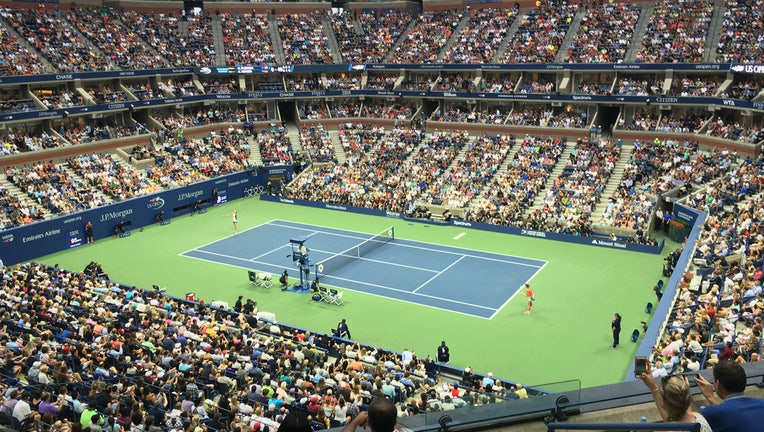 A women's tennis match being played at Arthur Ashe Stadium in New York