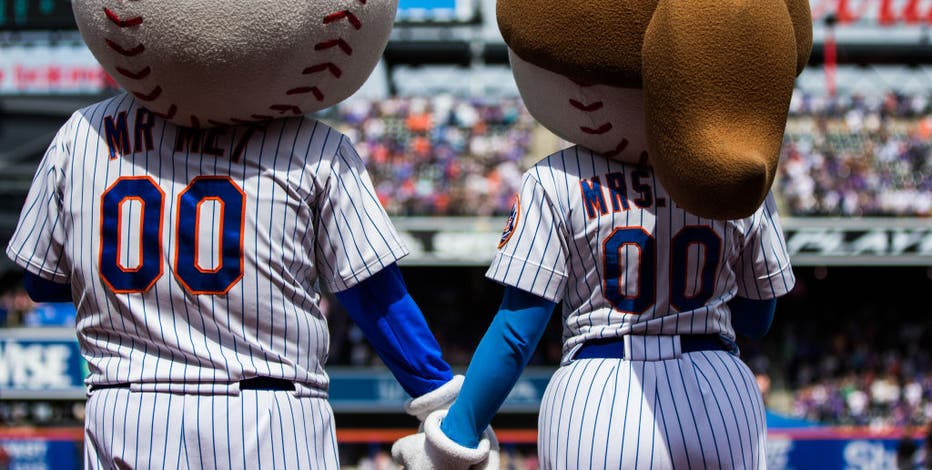 New York Mets mascots Mr. & Mrs. Met during the seventh inning