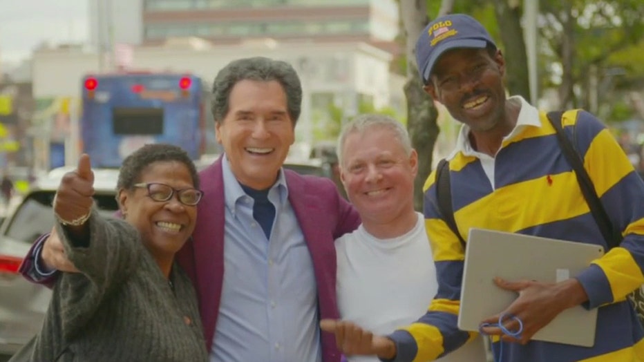 Ernie Anastos and some smiling New Yorkers