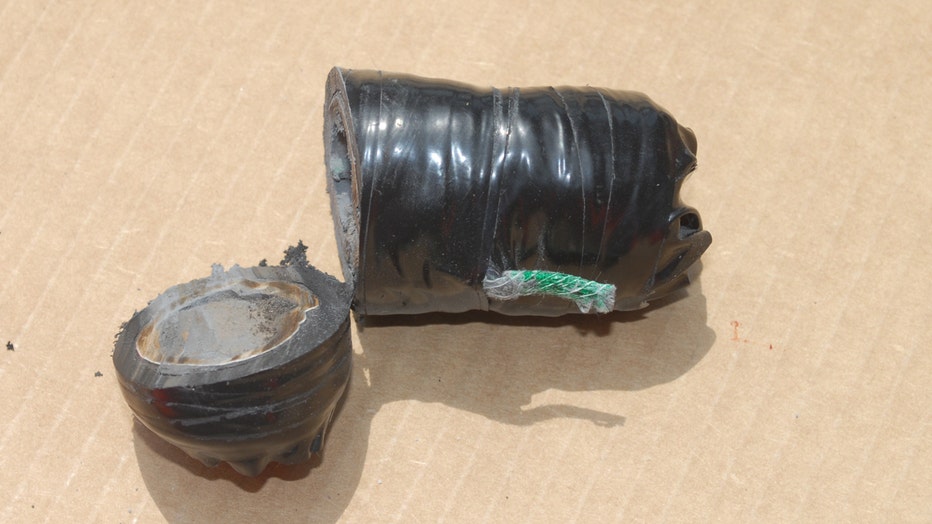 A cylindrical device police say is an IED