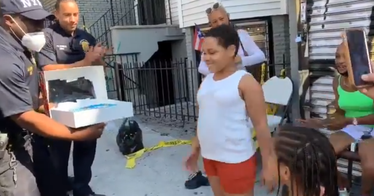 NYPD officers surprise Bronx girl whose home burned down with a cake ...