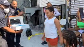 NYPD officers surprise Bronx girl whose home burned down with a cake for her birthday