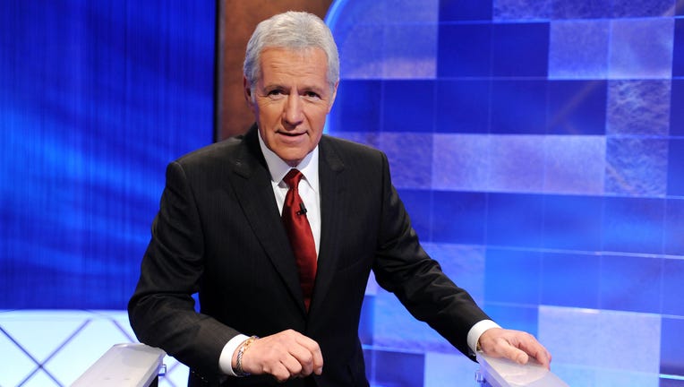 Game show host Alex Trebek poses on the set of the